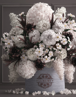 Bouquet white of flowers in a gift box