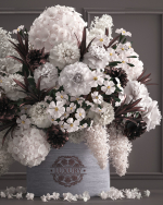 Bouquet white of flowers in a gift box