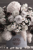 Bouquet white of flowers in a gift box