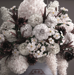Bouquet white of flowers in a gift box