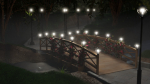 Bridge in woods with lights