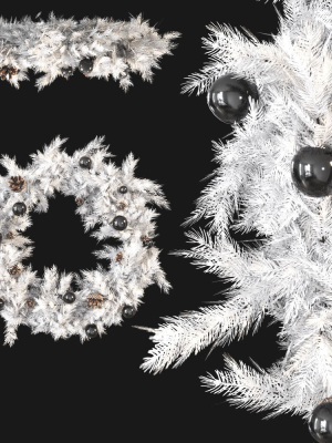 Christmas wreath with toys and pine cones