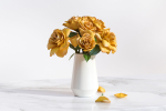 Yellow flowers in ceramic pot