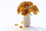 Yellow flowers in ceramic pot