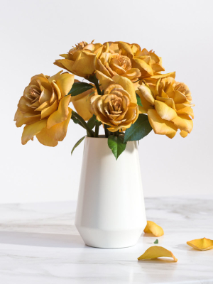 Yellow flowers in ceramic pot